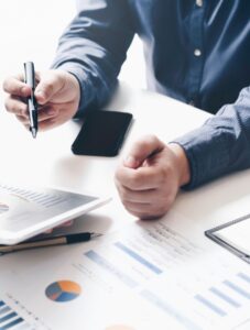 Closeup shot of male professional working on financial data.
